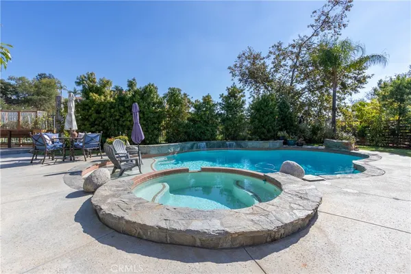 a view of a swimming pool with a patio