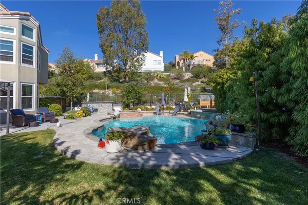 a view of a swimming pool with a patio