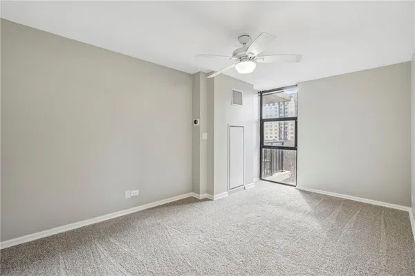 a view of an empty room with a window