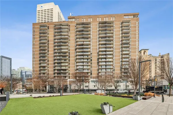 a front view of a building with outdoor space