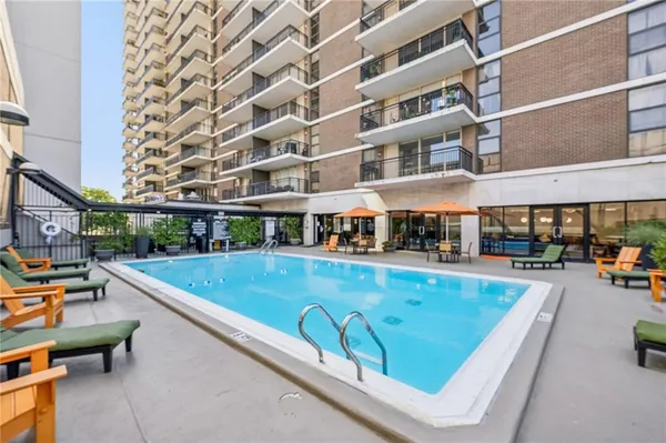 a view of a swimming pool with a lounge chair
