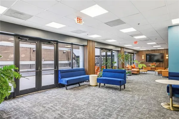 a lobby with furniture and natural light