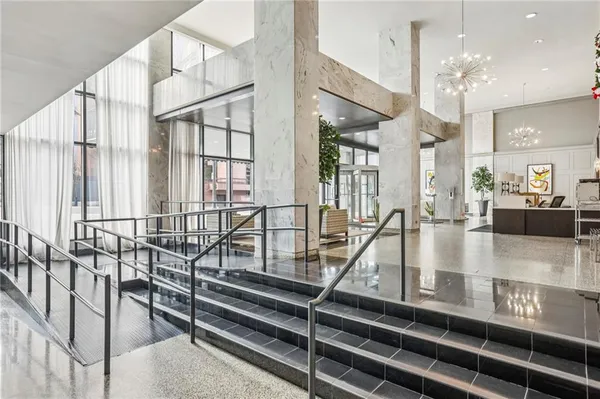 a view of entryway and hall with dining area