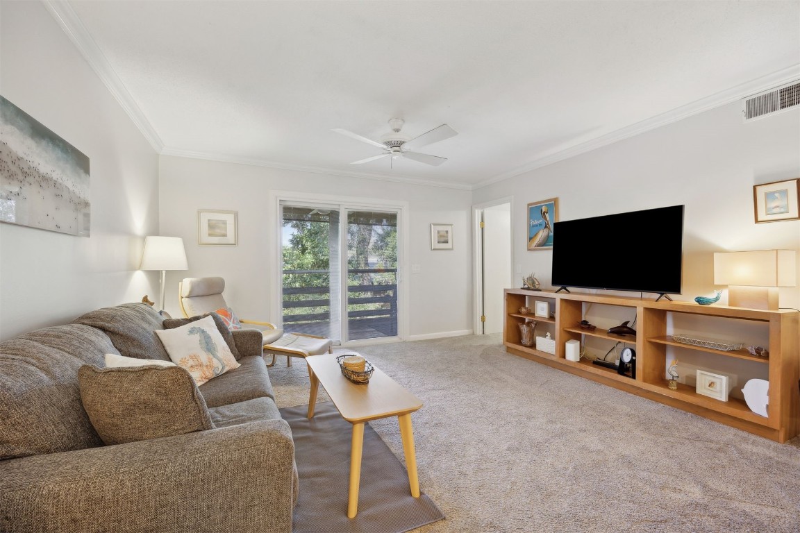 2328 Sadler Road, Unit 8F Fernandina Beach, FL 32034 - Photo 8 of 32 a living room with furniture and a flat screen tv