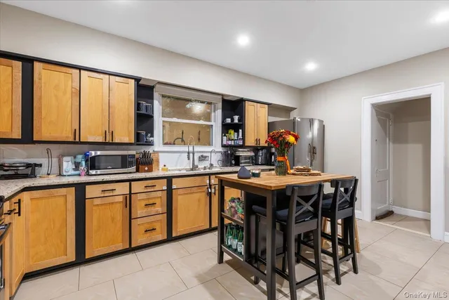 a kitchen that has a table and chairs in it