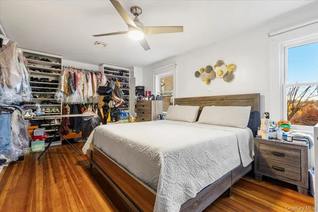 a bedroom with a bed and a walk in closet