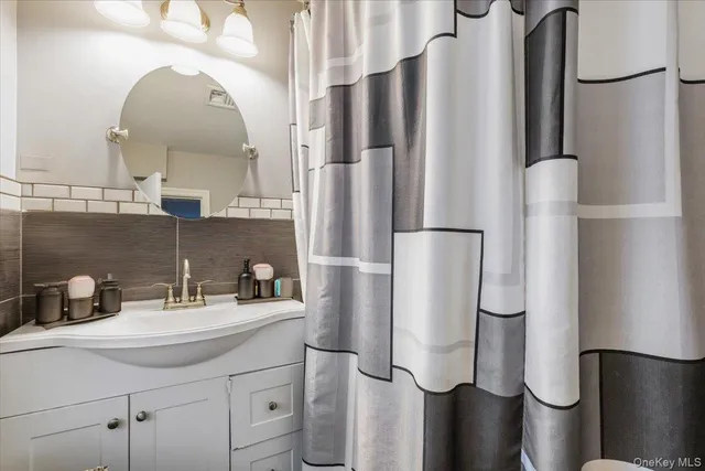 a bathroom with a sink and mirror
