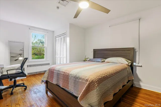 a bedroom with bed and window