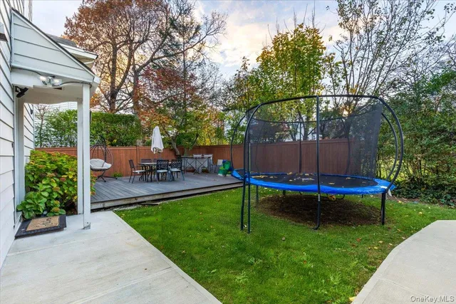 a view of a swimming pool with chairs in the patio