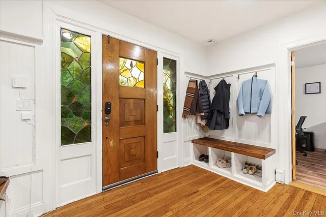 a living room with a bed and a window