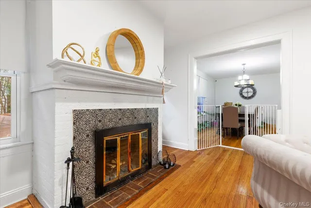 a view of living room with furniture and a fireplace