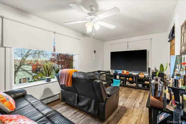 a living room with furniture fireplace and a flat screen tv