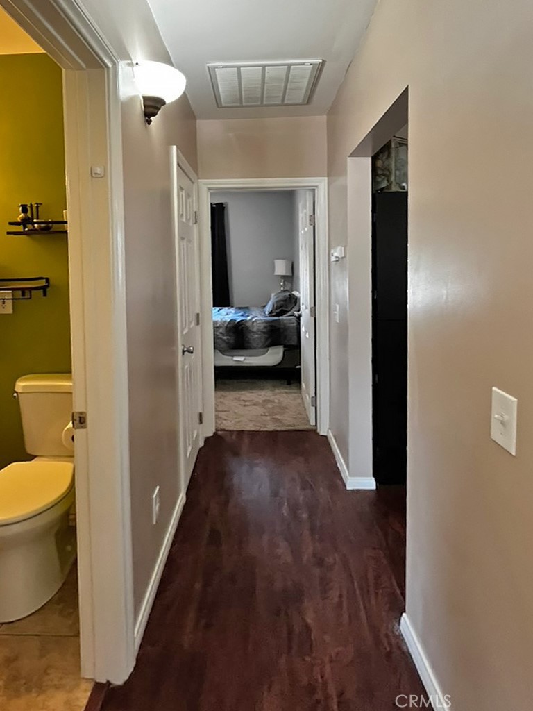 1205 Opal Way Mentone, CA 92359 - Photo 12 of 17 a view of a bathroom from a hallway