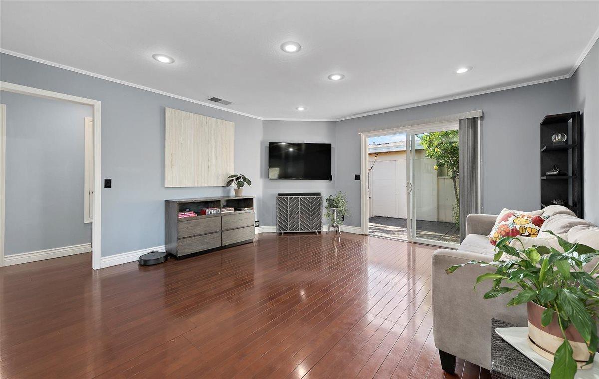 1 Comstock Queen Court Mountain View, CA 94043 - Photo 4 of 16 a living room with furniture flat screen tv and wooden floor