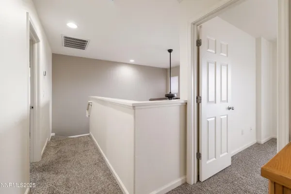a view of hallway with livingroom