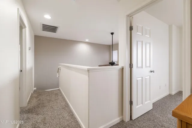 a view of hallway with livingroom