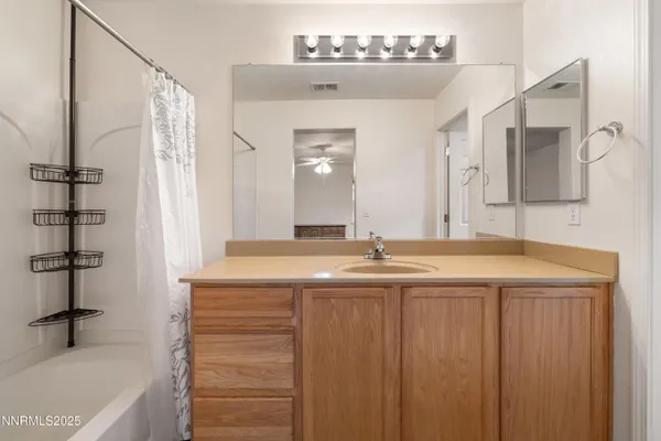 a bathroom with a sink double vanity and a bathtub
