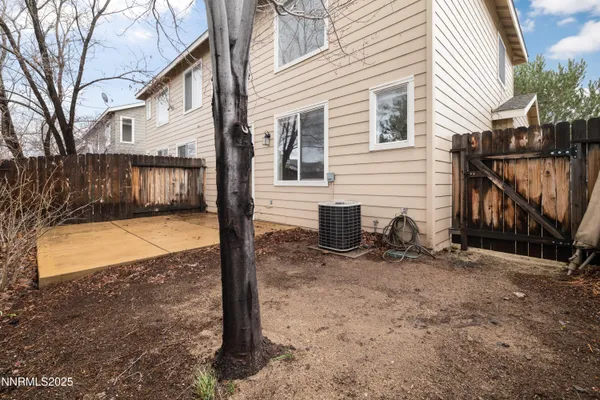 a view of a house with backyard in the backyard