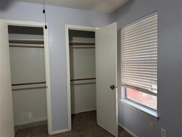 a bathroom with a shower and a toilet