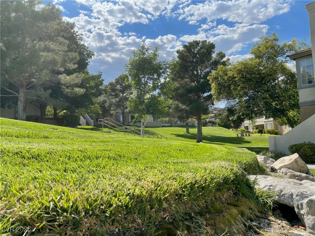 10217 King Henry Avenue, Unit 104 Las Vegas, NV 89144 - Photo 16 of 18 View of grassy yard