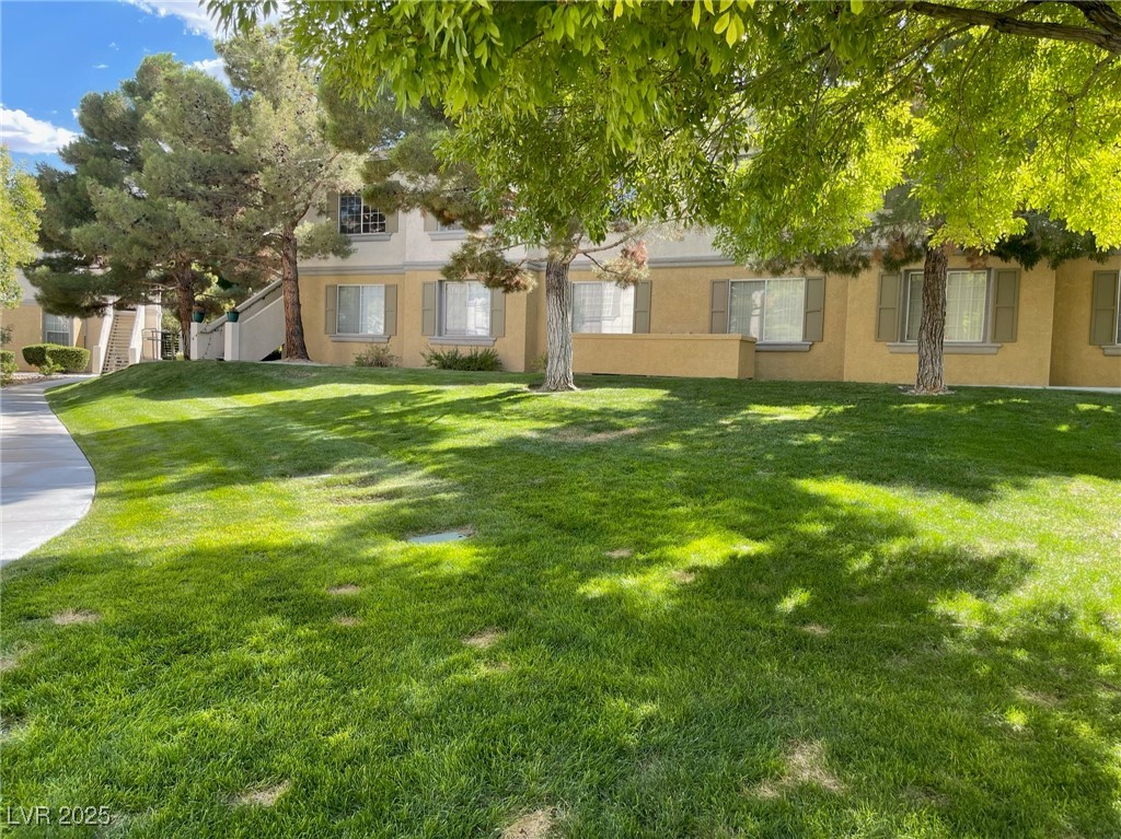 10217 King Henry Avenue, Unit 104 Las Vegas, NV 89144 - Photo 17 of 18 View of green lawn