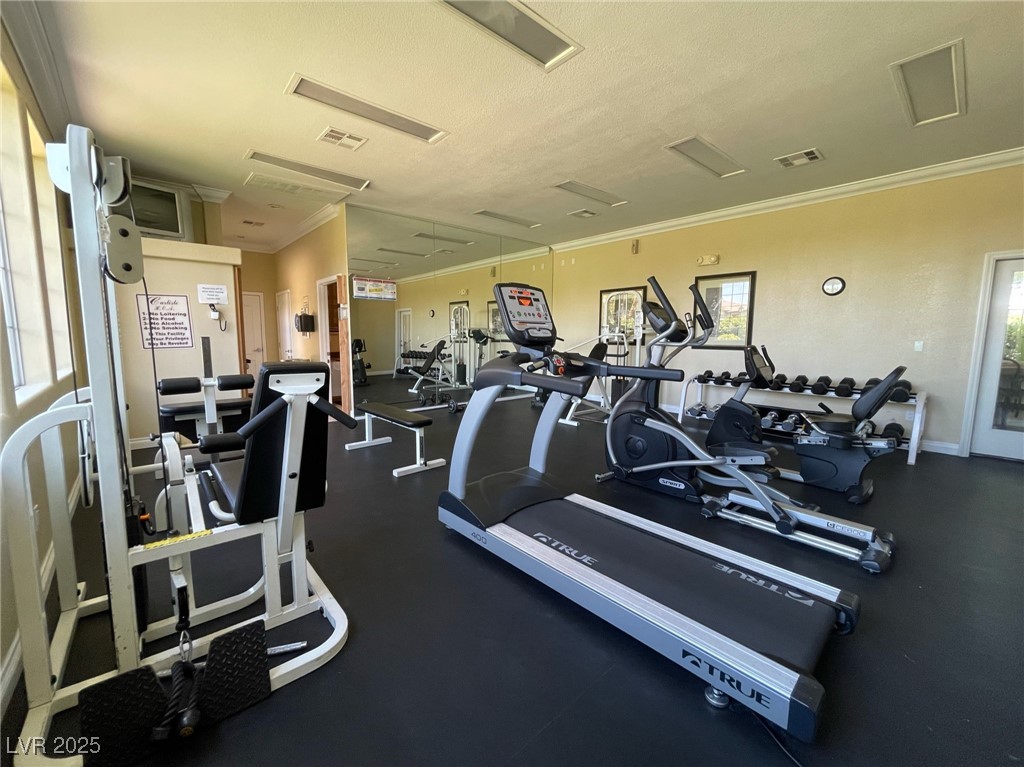 10217 King Henry Avenue, Unit 104 Las Vegas, NV 89144 - Photo 4 of 18 Gym featuring ornamental molding