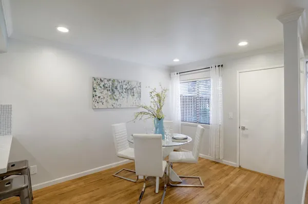 a workspace room with furniture and wooden floor
