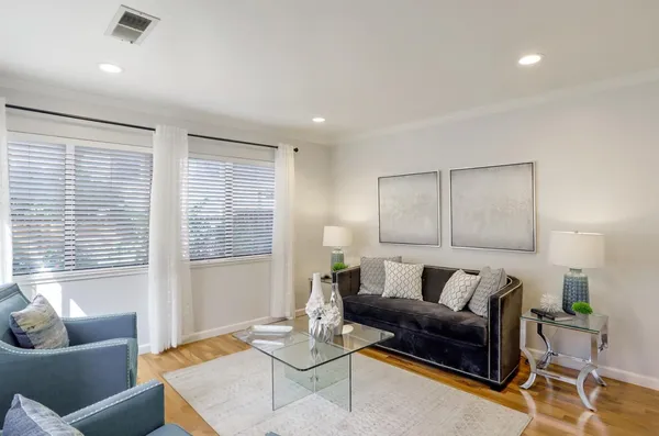 a living room with furniture and a window