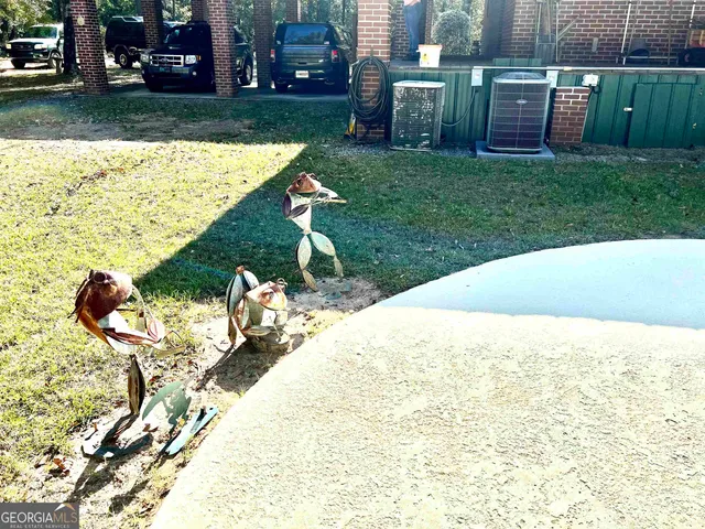a bathroom with a granite countertop sink and a large mirror