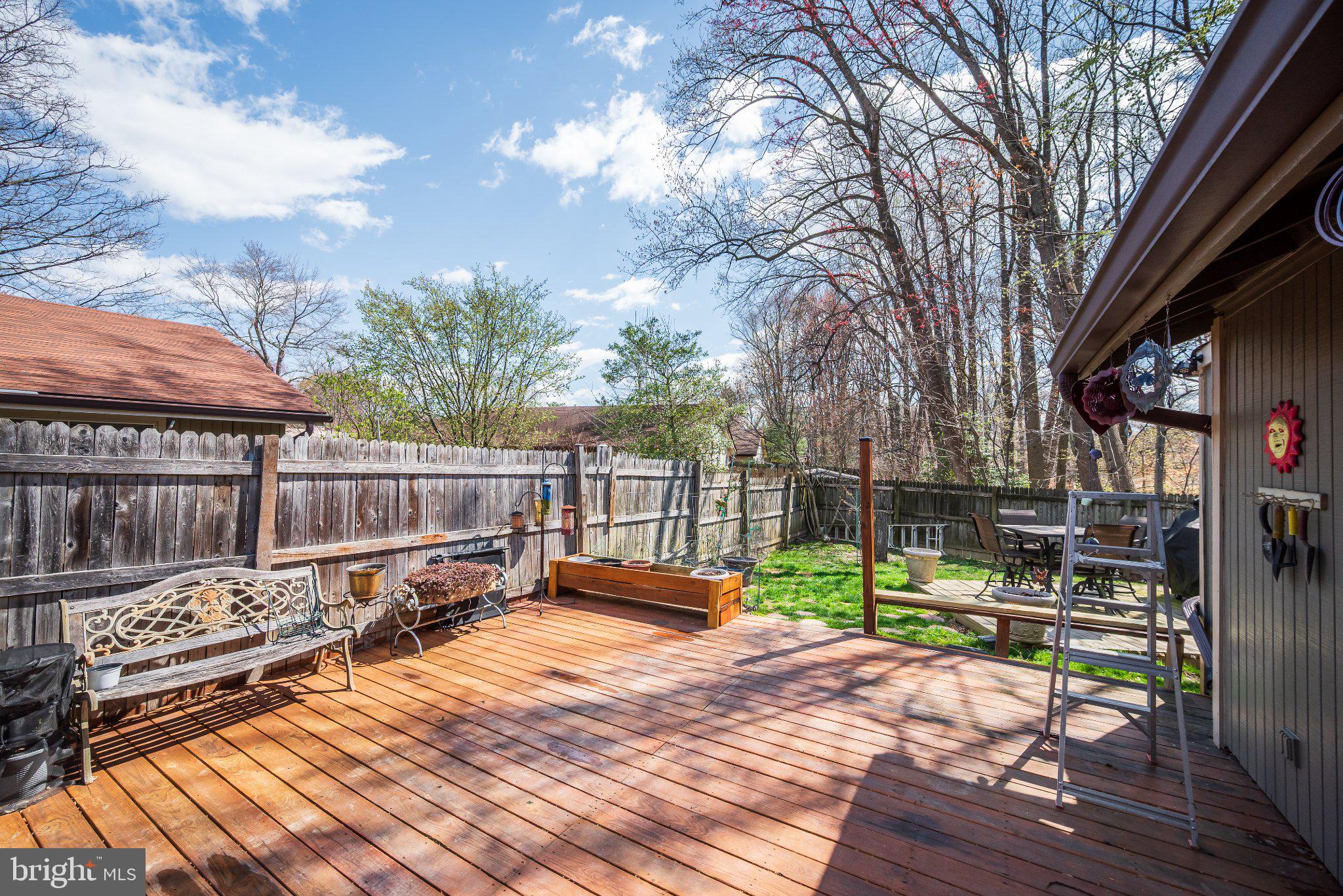 11 Aquarius Court Silver Spring, MD 20906 - Photo 32 of 49 Sunny deck with lush greenery backdrop.