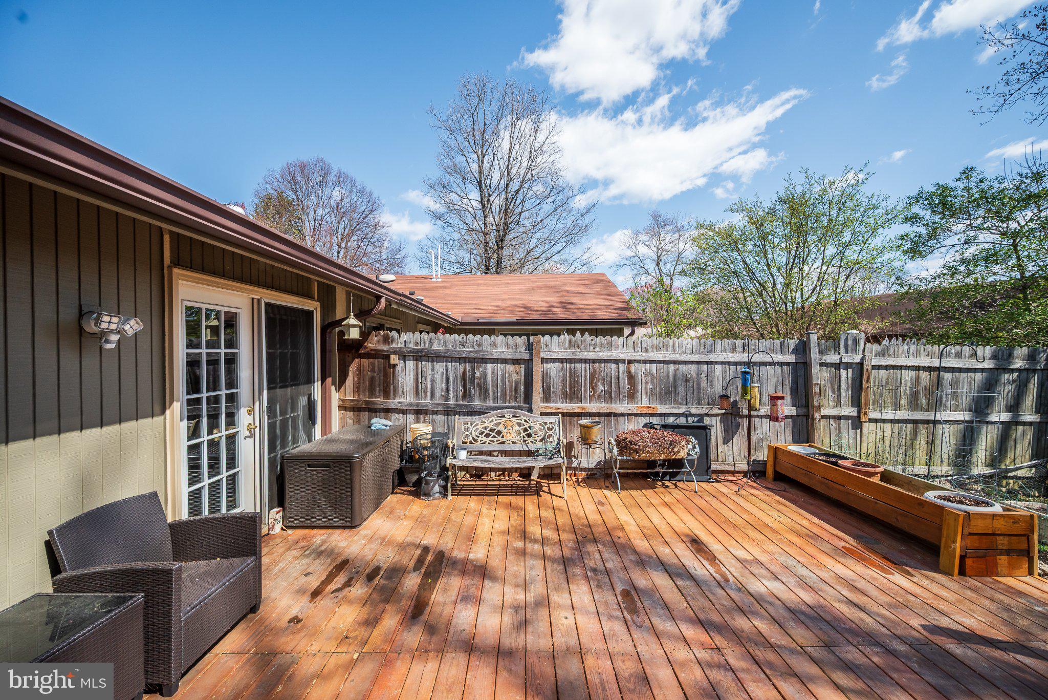 11 Aquarius Court Silver Spring, MD 20906 - Photo 33 of 49 Sunny deck with lush greenery backdrop.