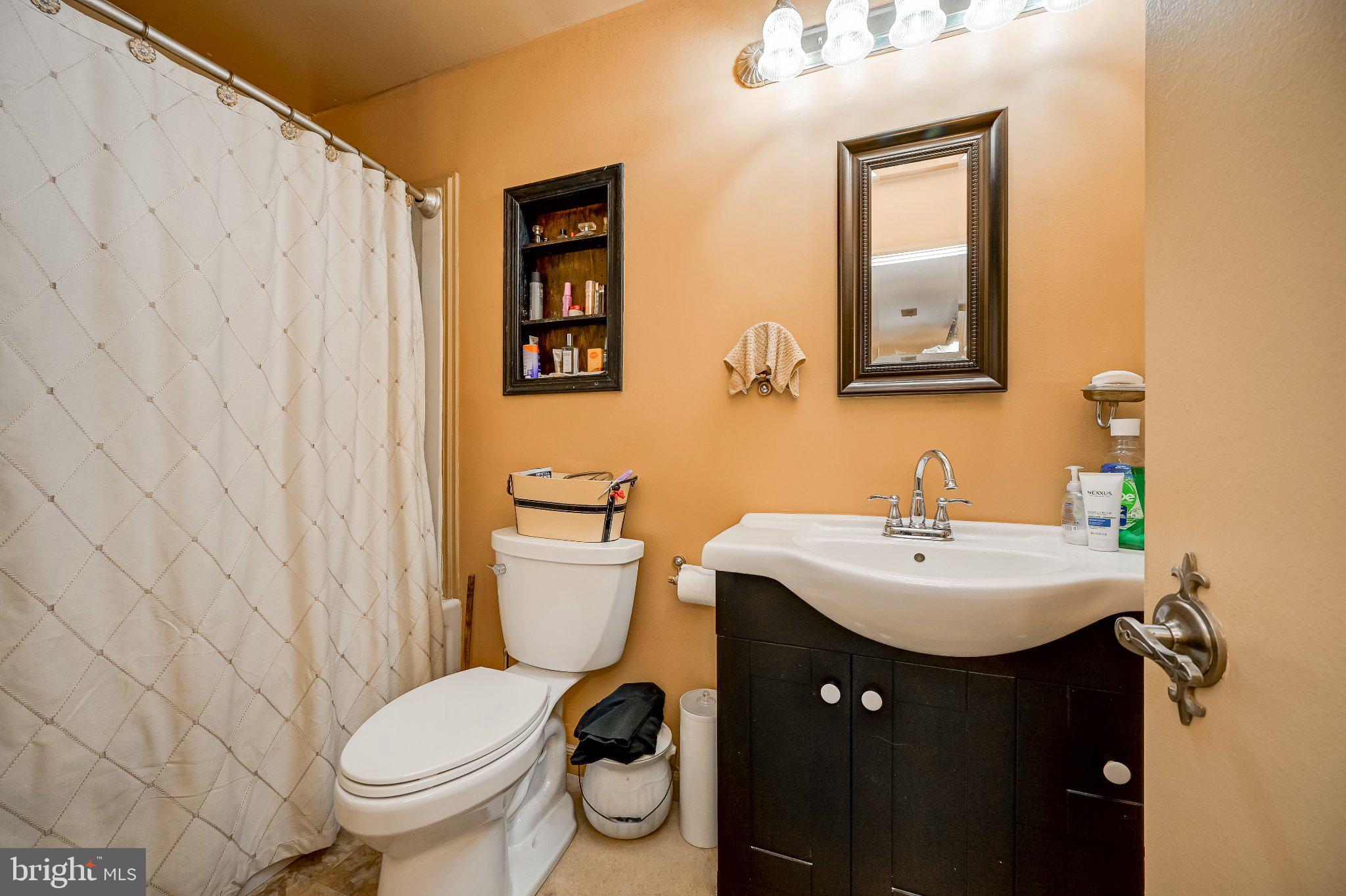 11 Aquarius Court Silver Spring, MD 20906 - Photo 45 of 49 Cozy bathroom with warm tones.