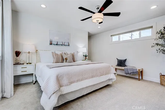 a bedroom with bed and window