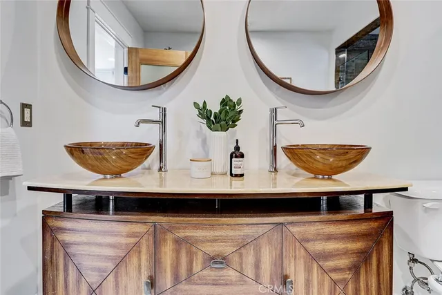 a close view of dining table with a mirror and a table