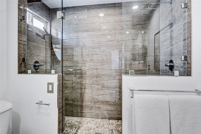 a bathroom with a shower and a sink