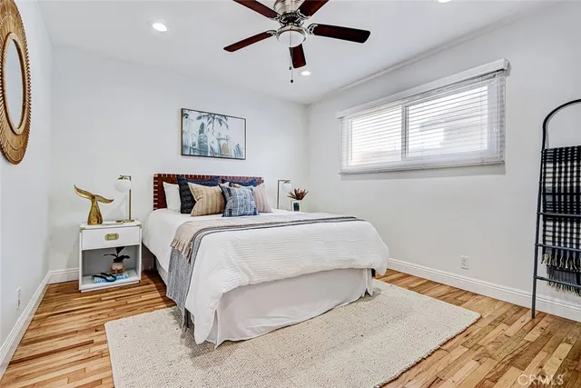 a bedroom with bed and window