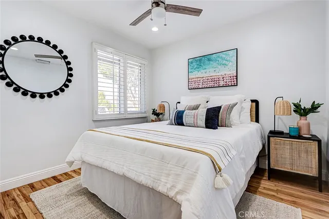 a bedroom with bed and a window