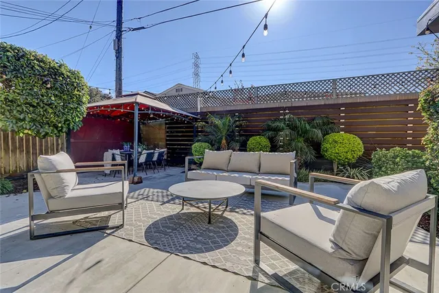 a patio with a table and chairs