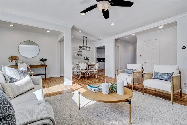a living room with furniture and kitchen view