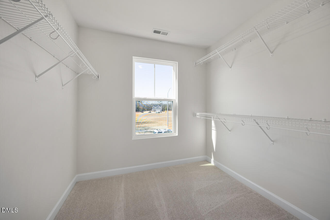 233 Tenure Lane Lillington, NC 27546 - Photo 22 of 30 an empty room with windows