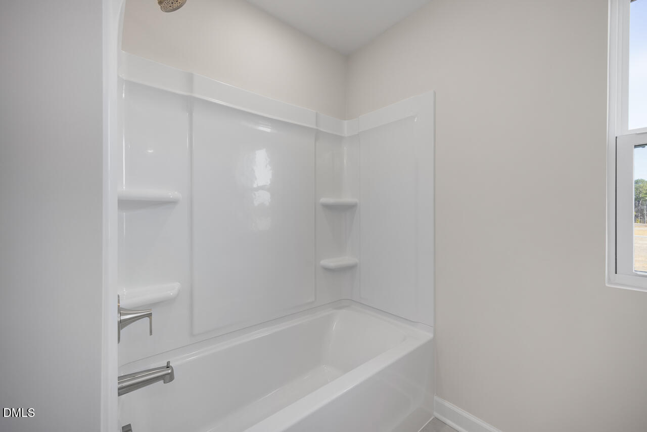 233 Tenure Lane Lillington, NC 27546 - Photo 27 of 30 a close view of a bathtub in bathroom