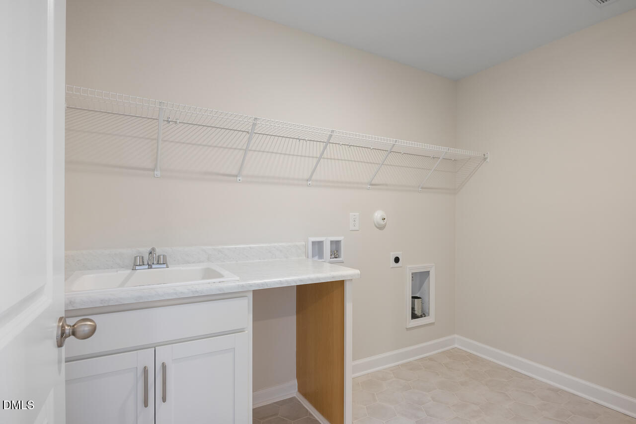 233 Tenure Lane Lillington, NC 27546 - Photo 28 of 30 a bathroom with a sink vanity and a mirror