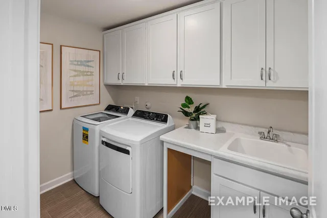 a bathroom with a sink double vanity and a mirror