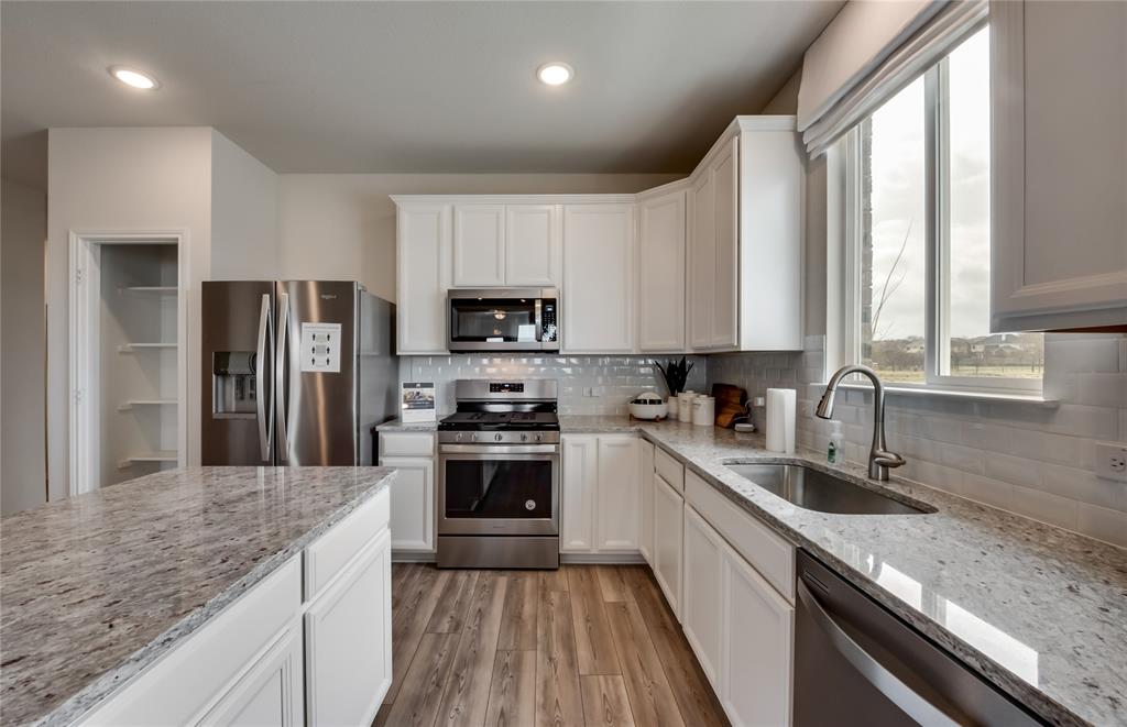 14053 Ladbroke Street Pilot Point, TX 76258 - Photo 6 of 19 Abundant cabinet space in kitchen