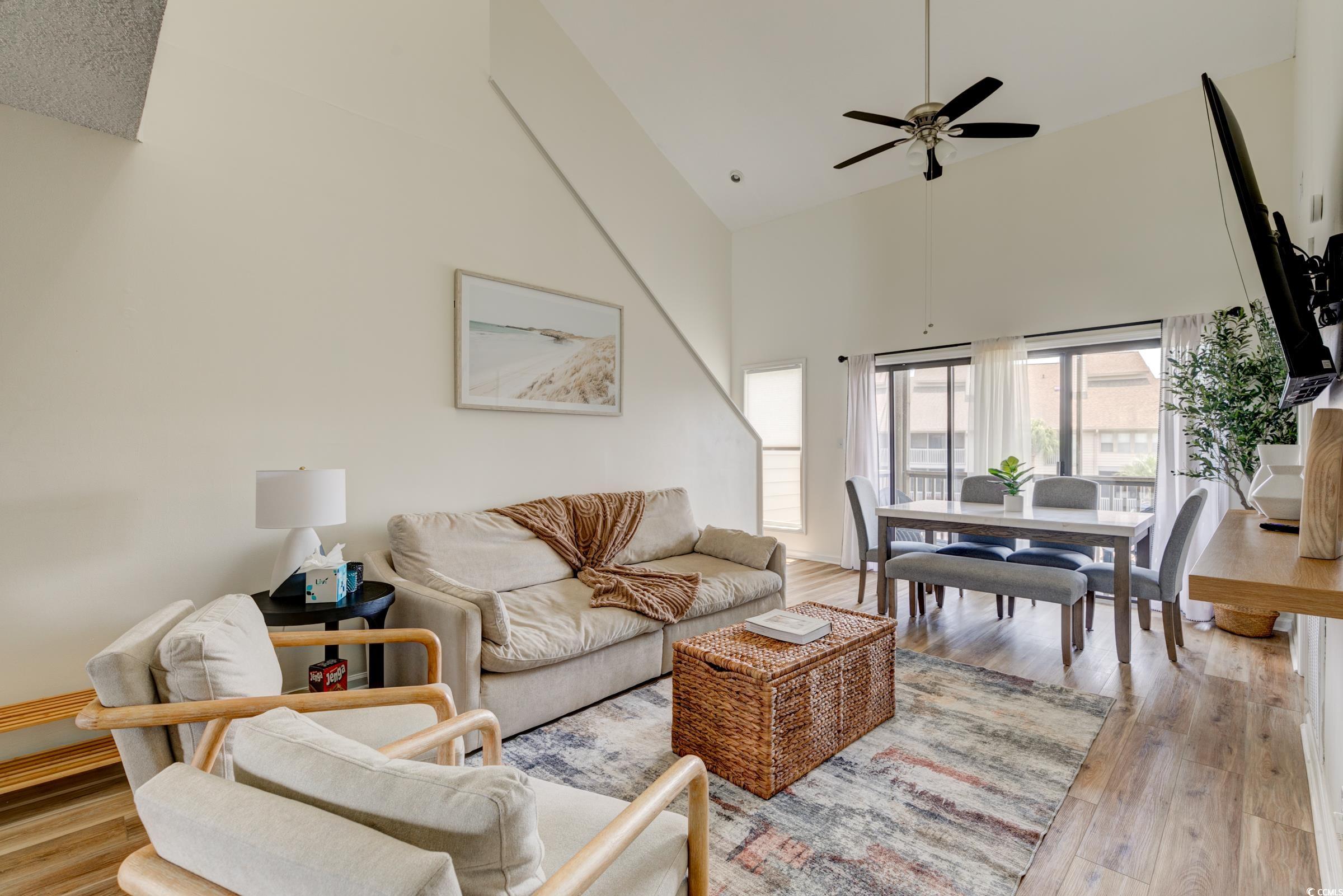 1356 Glenns Bay Road, Unit 202B Surfside Beach, SC 29575 - Photo 6 of 40 Living room with high vaulted ceiling, ceiling fan