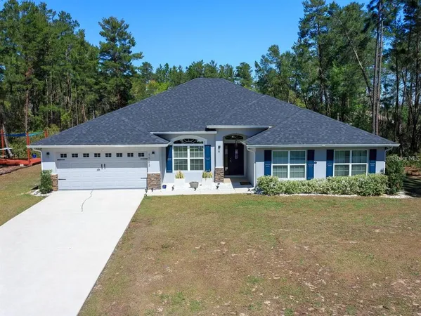 a front view of a house with a garden and porch