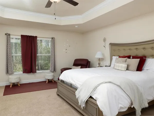 a spacious bedroom with a bed and a couch