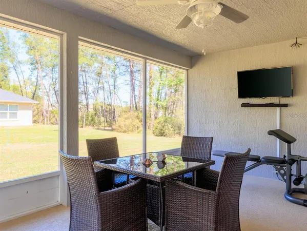 a view of a dining room with furniture window and outside view