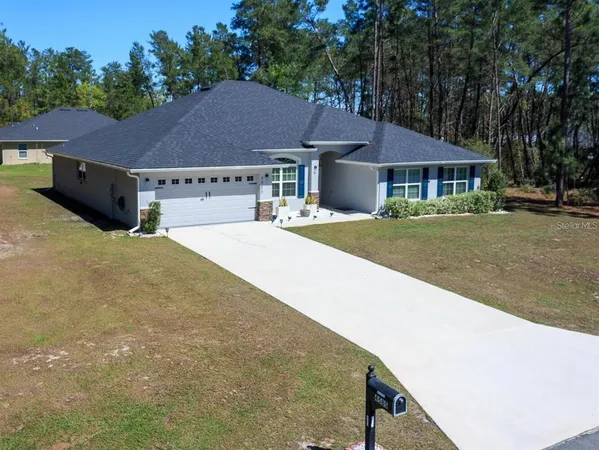 a house with yard in front of it
