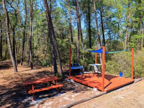 a view of a park with iron fence